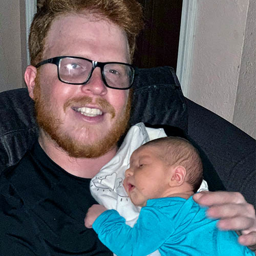 CNS Patient Nick Holloway with newborn son