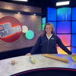 Stefanie Ramos on the set of Do the Math with grocery store props.