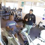 Patient Gerald in physical therapy with a therapist